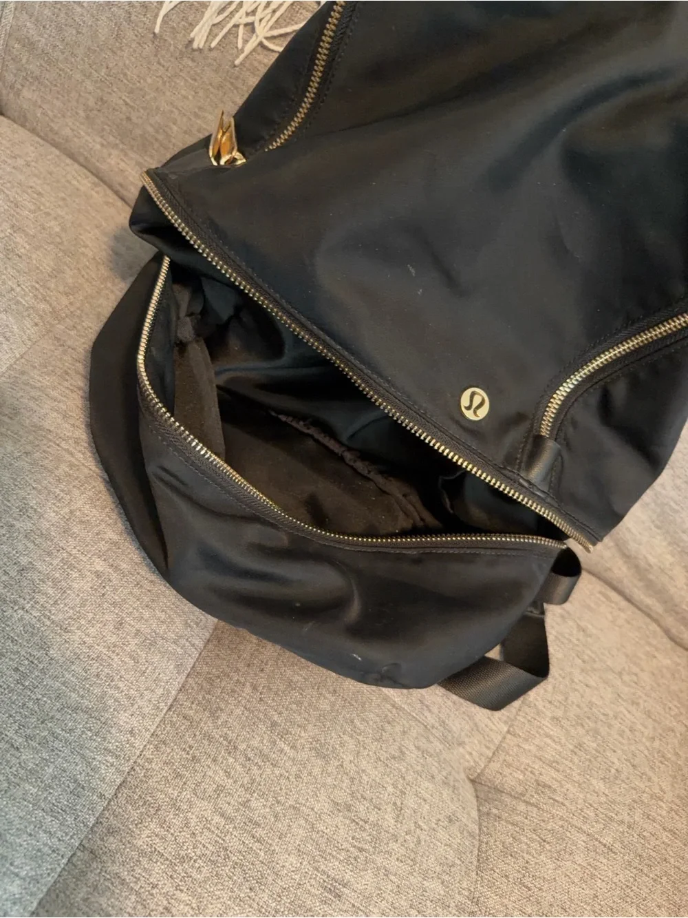 lululemon athletica Black Sling Backpack with Gold Zippers